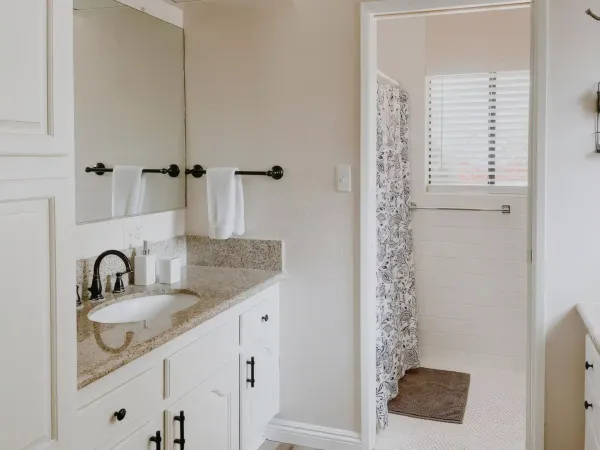 Bright bathroom with rustic-modern finishes at San Diego Trail Company's Airbnb ranch in Poway, CA