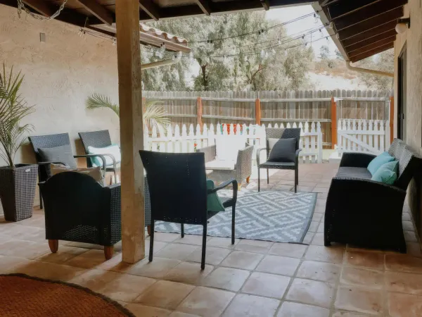 Poolside lounge under blue skies at San Diego Trail Company's Airbnb ranch in Poway, CA
